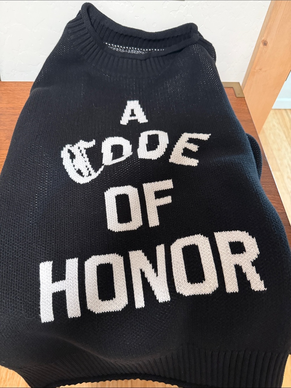 Black Crewneck Sweater with 'A Code of Honor' Text